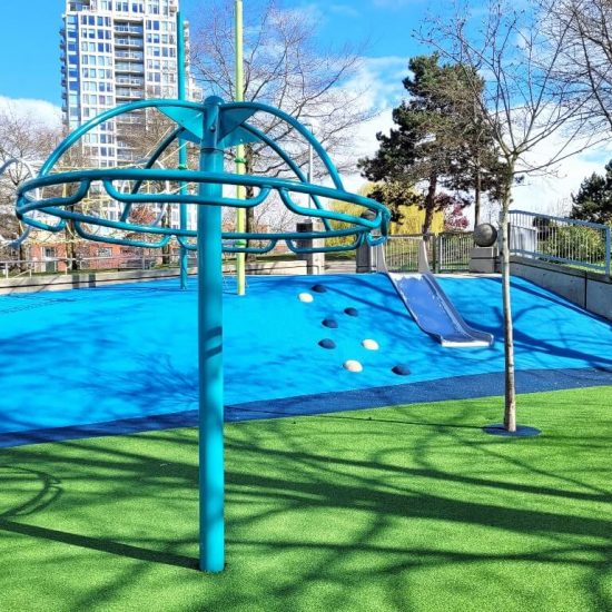 Slide and overhead spinner at Crosstown elementary playground